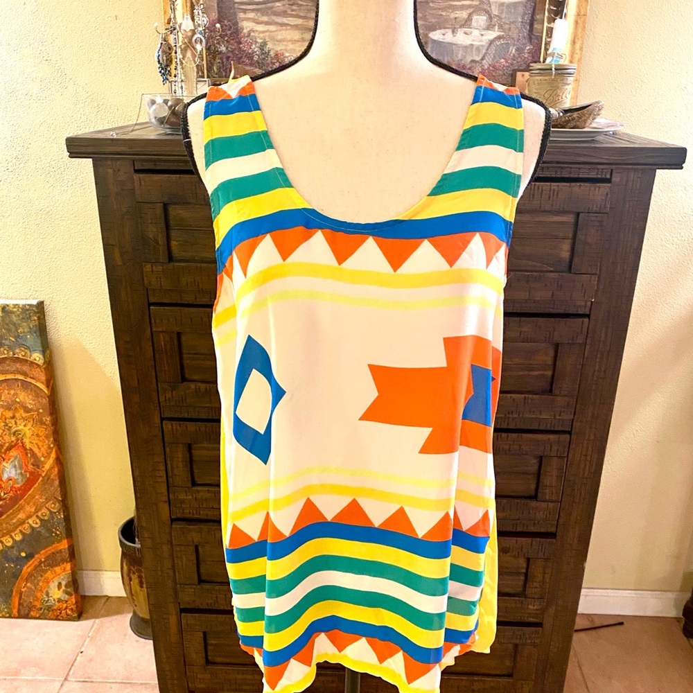 Vibrant colored sleeveless top by Umgee